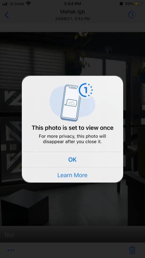 Tap OK to view the photo or video in WhatsApp