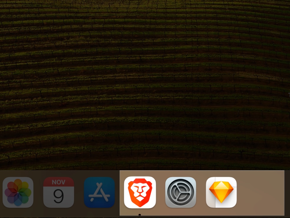 Drag and drop apps in Dock separated by space