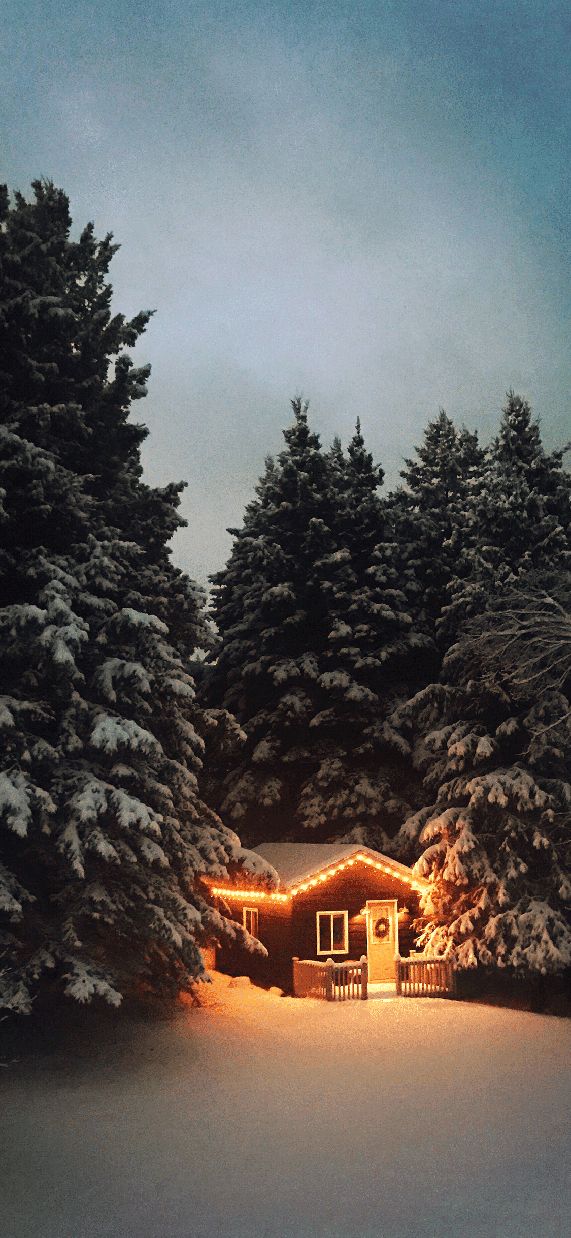 Snow covered house in winter iphone wallpaper