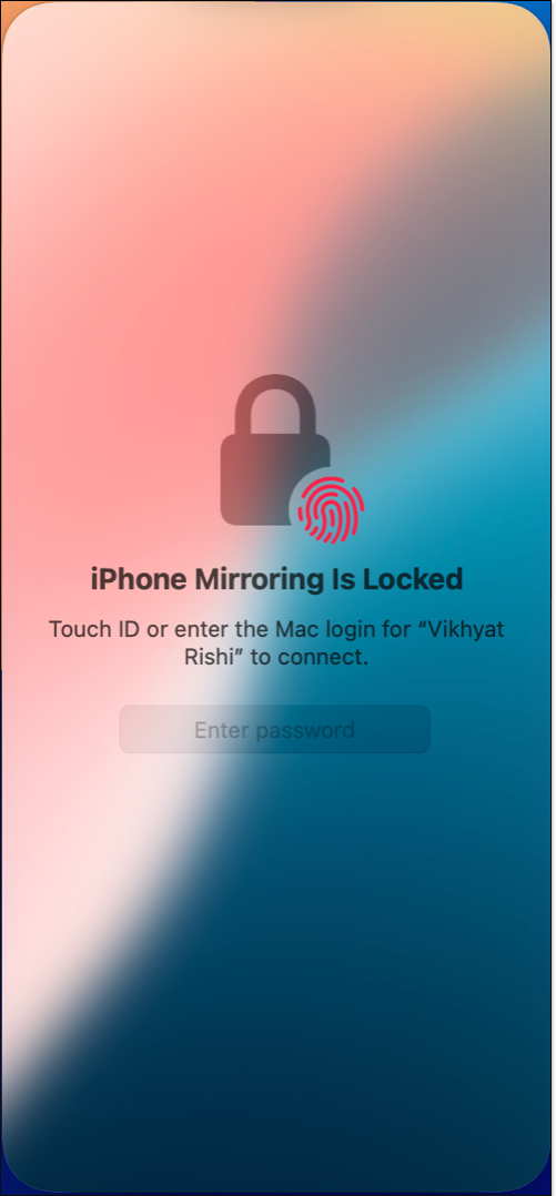 Unlocking the iPhone Mirroring app on a Mac using Mac password or Touch ID.