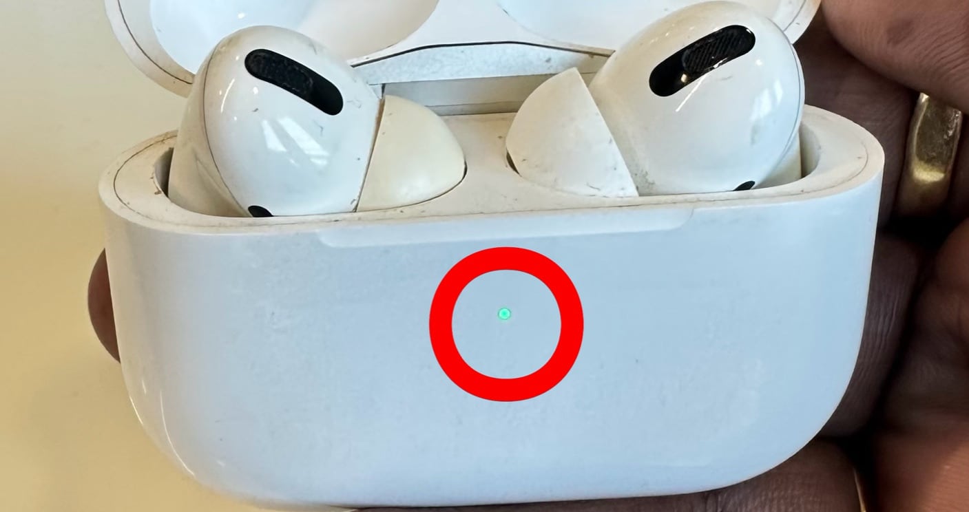 Green LED indicator on AirPods indicating battery fully charged