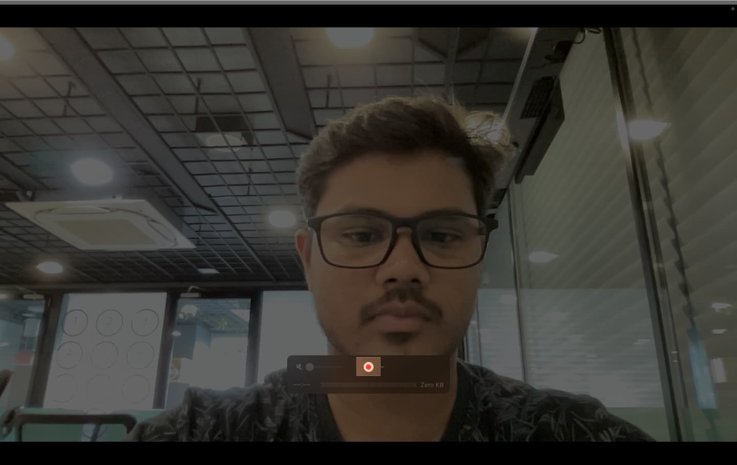 Clicking the record button in QuickTime Player to record a video